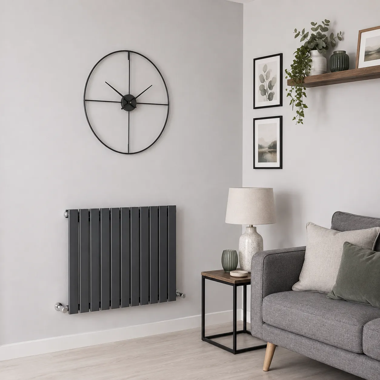 A horizontal flat panel designer radiator in anthracite grey, mounted low on a living room wall.
